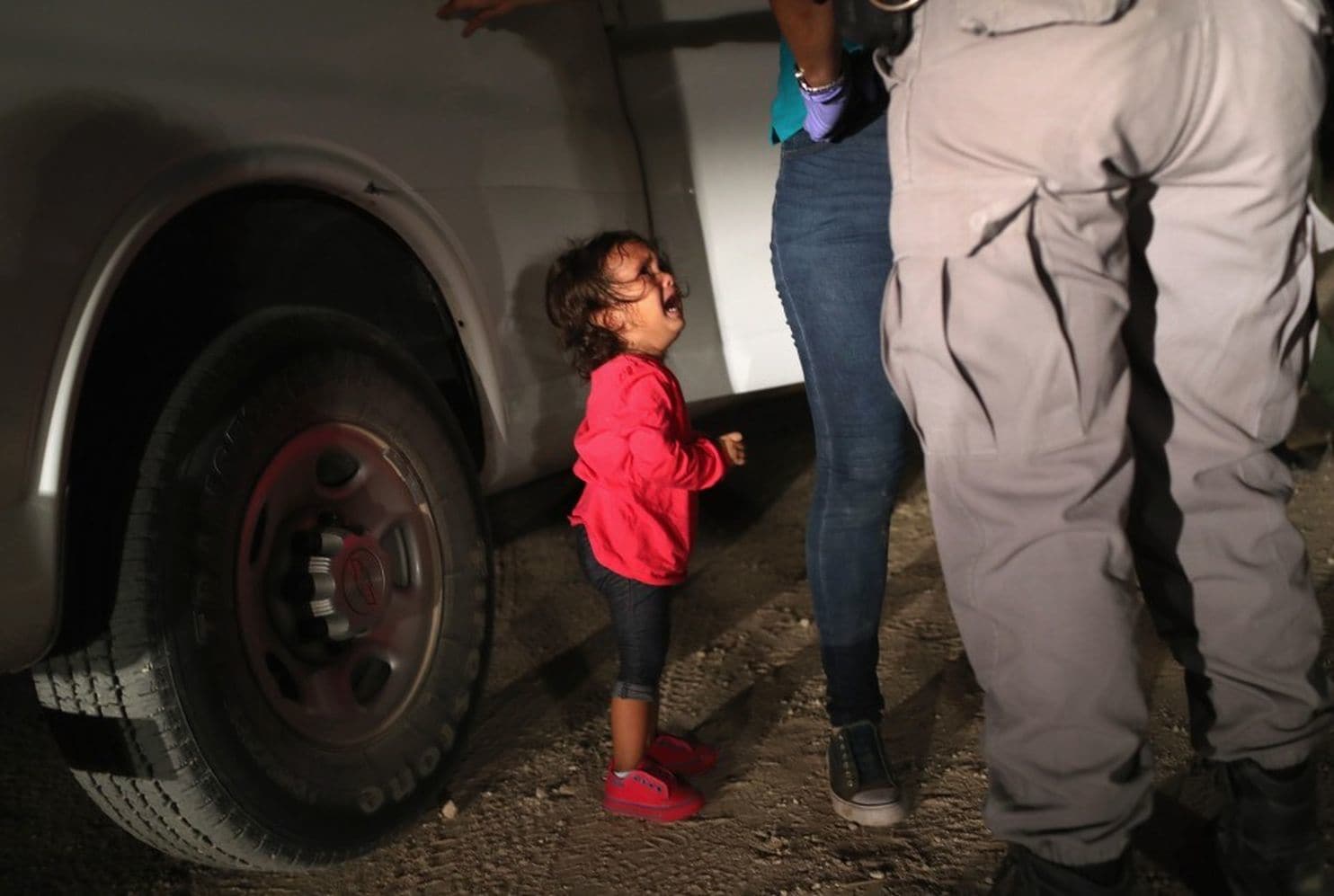 Mother and child being detained by ICE. (image pilfered from the Washington Post)